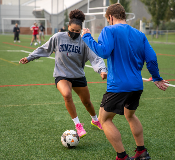 Kinesiology and Sport Management students play soccer during class