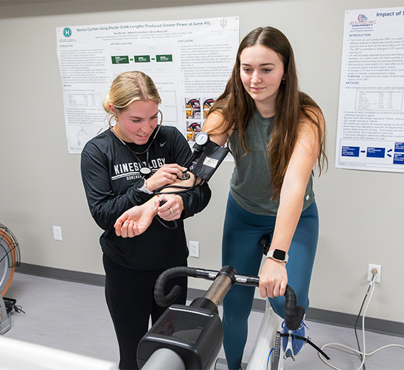 student on bike in kinesiology lab