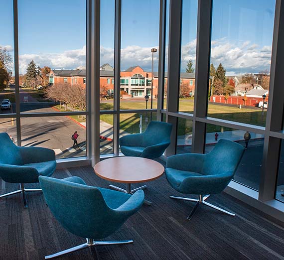 Blue chairs overlooking Rosauers Center in the backkground.