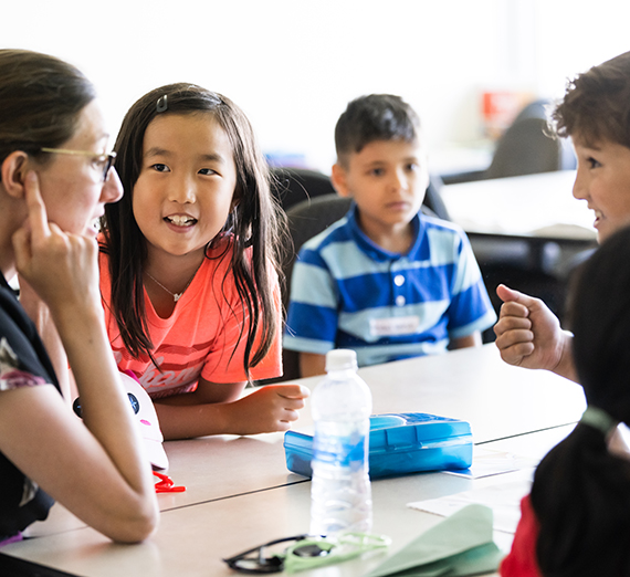 Teacher with children smiling 