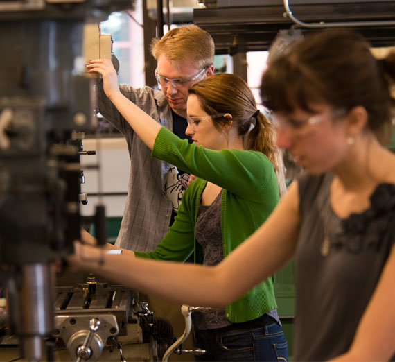 Engineering students using lab equipment 