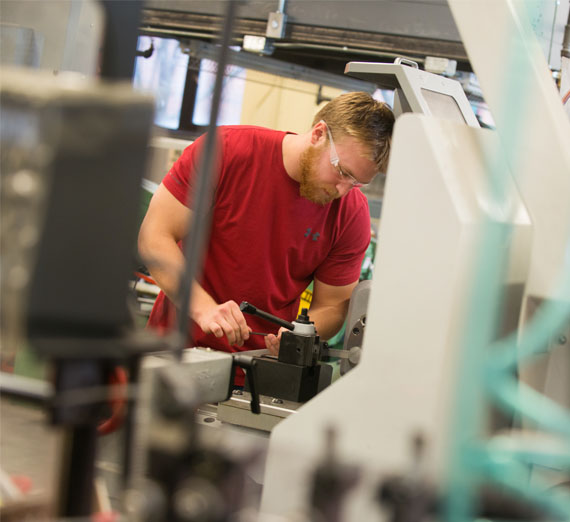 Engineering student in machine shop 