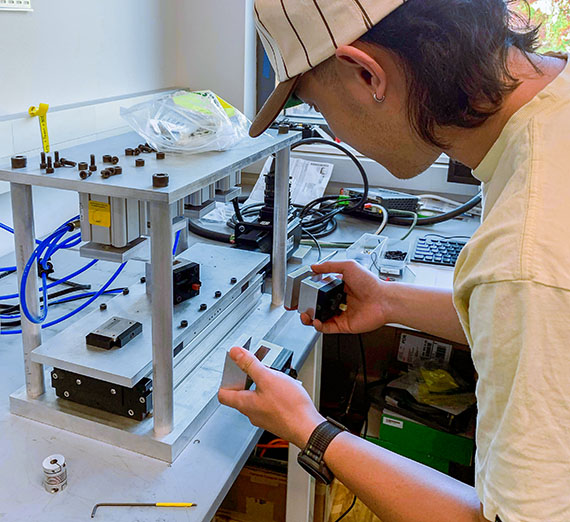 student with equipment