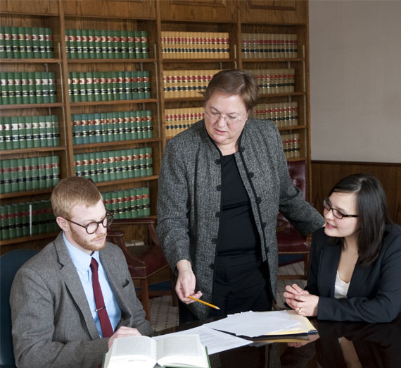 law school professor helping students