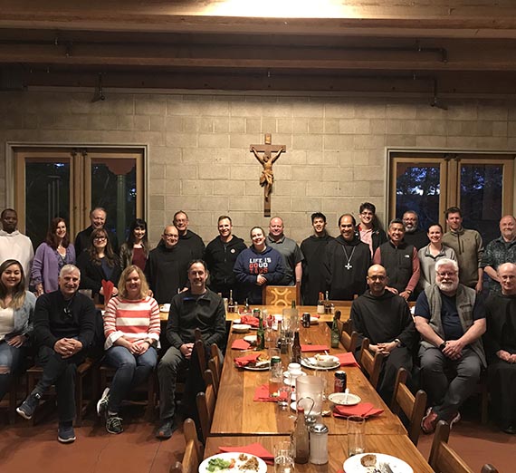 Students, professors and monks pose for photo at St. Andrew's Abbey
