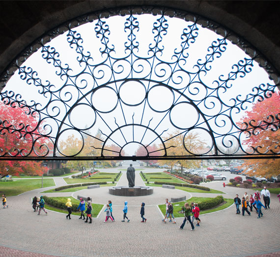 kids walk in front of college hall 