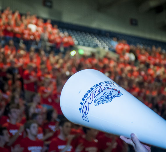 students cheering at basketball game 