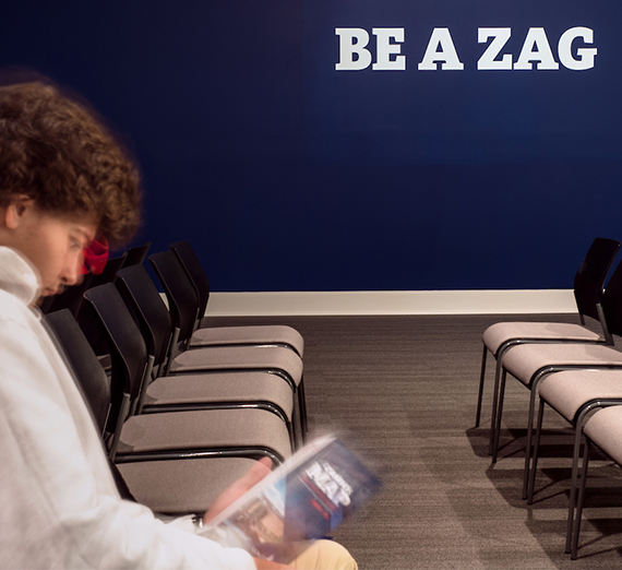 Prospective student waits in an admissions waiting room