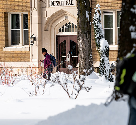student walking in snow