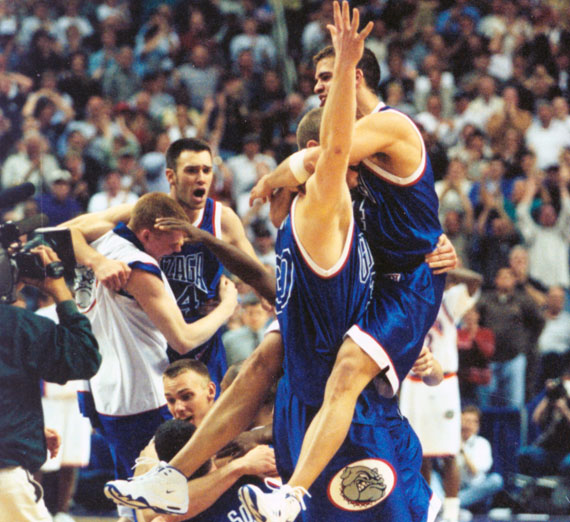 The men's team celebrates its 1999 NCAA Tournament win.