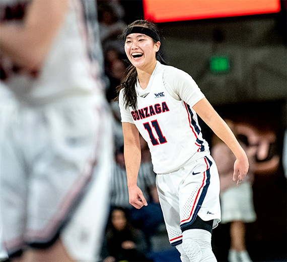 women's basketball player celebrating