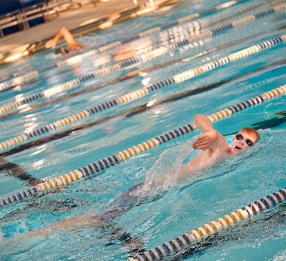 student swimming at race 