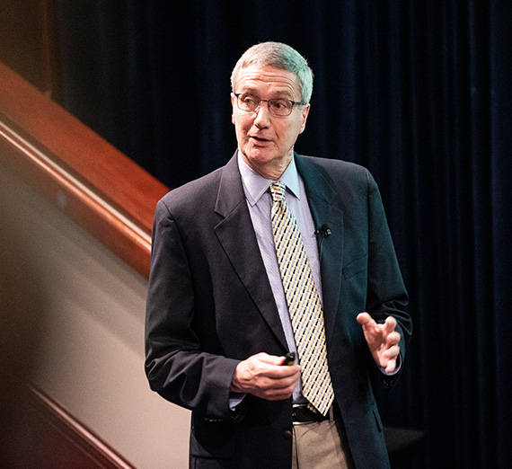 Man speaking at student event