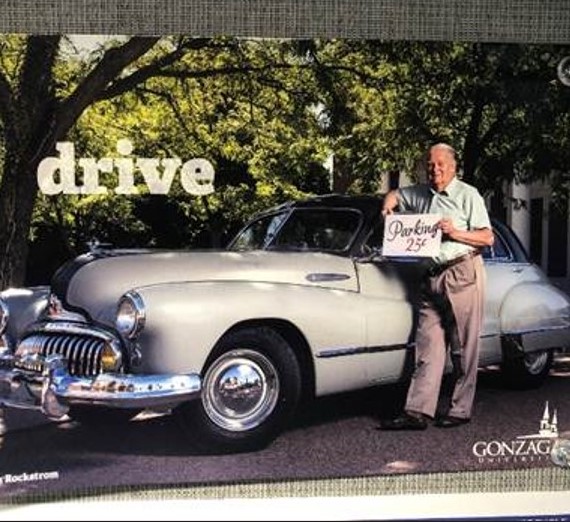 Don holding 25 cent sign