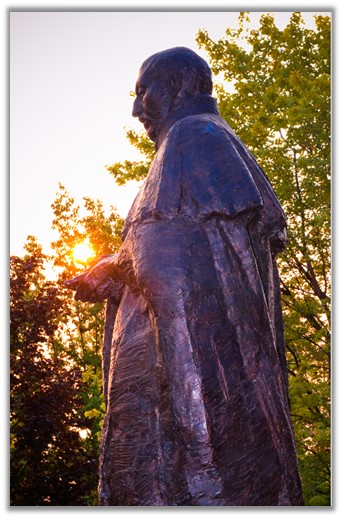 Image of St. Ignatius Statue in front of College Hall