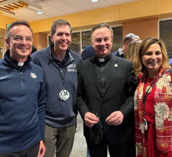 Stock image of journalism supplies including a computer, cassette player, camera, newspaper, and headphones.
