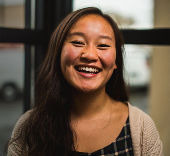 Student Masuda Fong smiles at the camera.