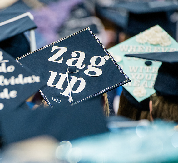 commencement cap says Zag Up