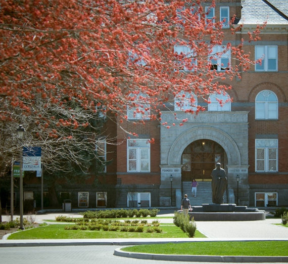 Front of college hall in the fall.