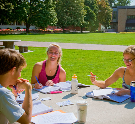 students doing homework outside 