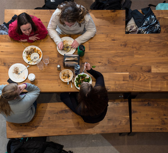 students at table in dining hall 