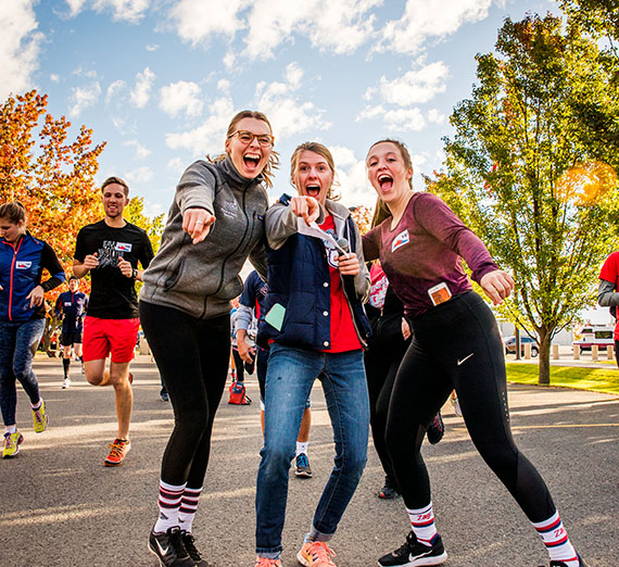 Students smiling during a run