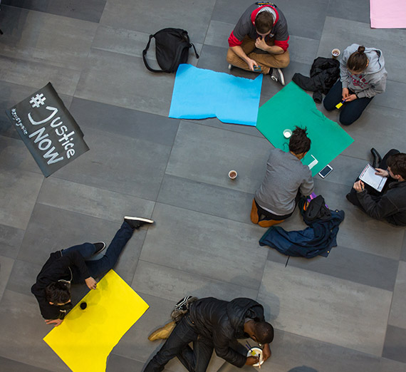 Gonzaga students makes signs for the Martin Luther Kind Day March.