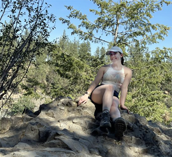 Emmy Wagner poses for a picture on the trail