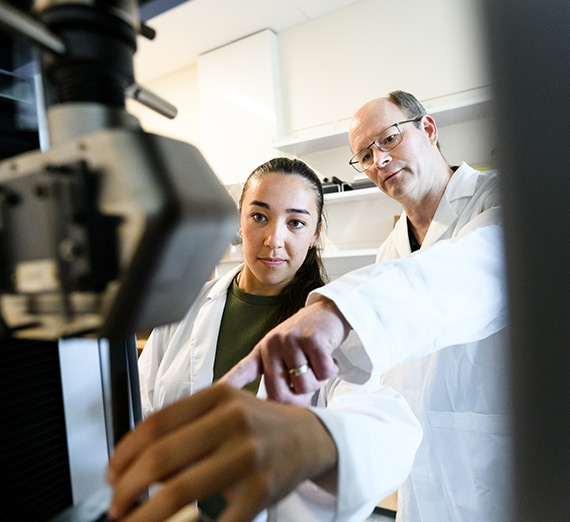 A student and professor work in the Bollier Center.