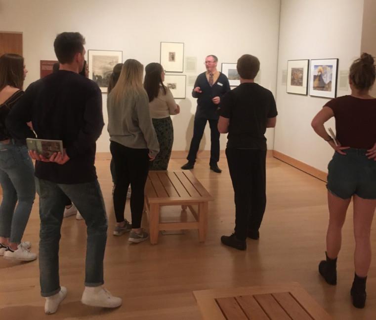 Study abroad students visiting art exhibit 
