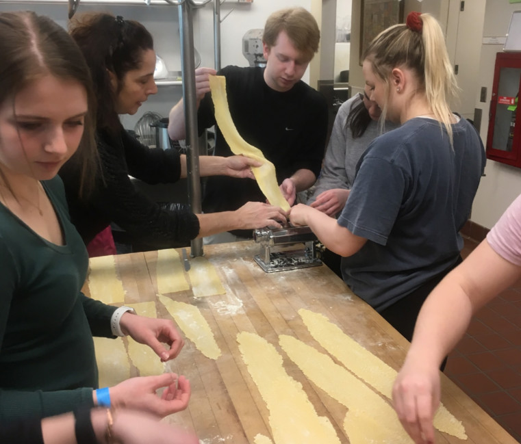 Students making pasta while studying abroad in Florence
