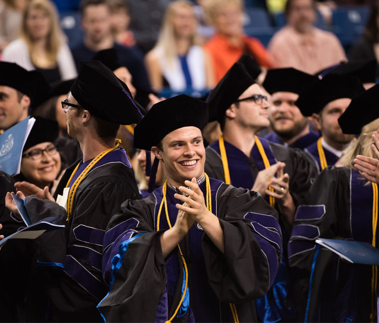 Students clapping during School of Law commencement 