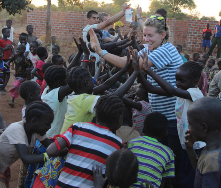 student highfiving youth