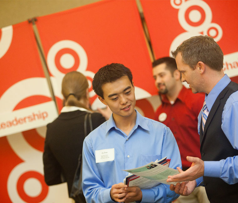 Student talking to Target representative at career fair 