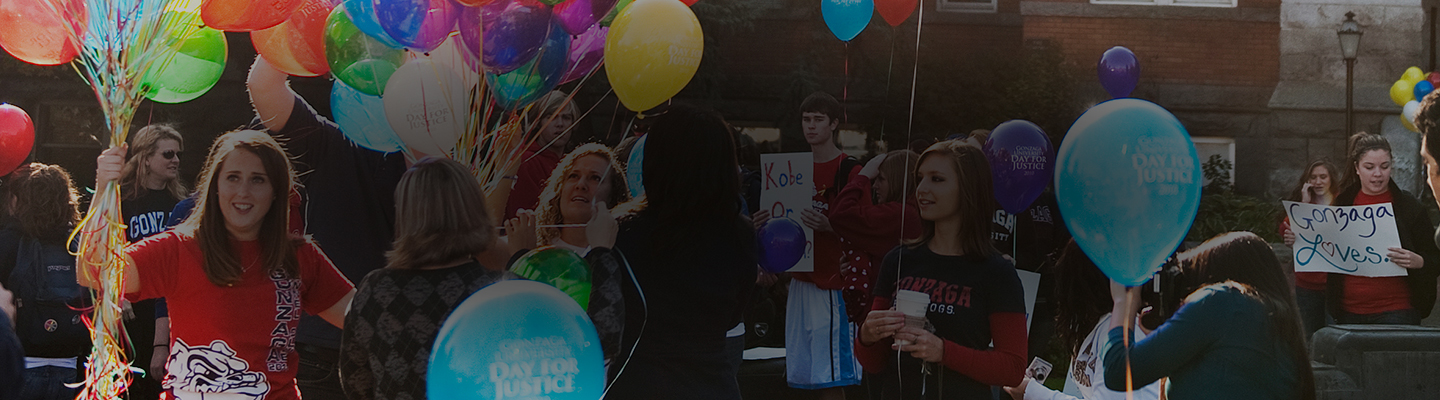 Students hand out balloons for Gonzaga Day of Justice