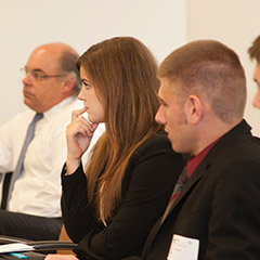 Students at conference room table.
