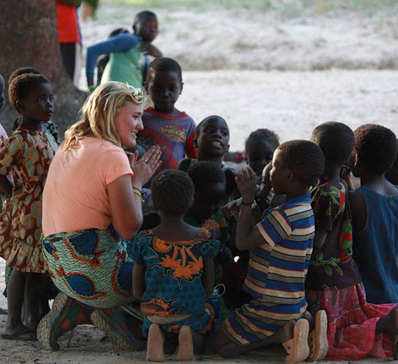 Student with children in Zambia