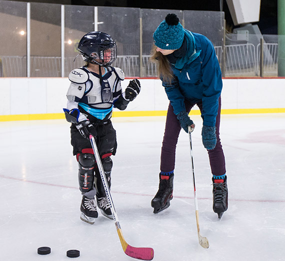 Gonzaga students, working with GU Professor Mark Derby, help youth in the Gonzaga Exceptional Hockey Program at Riverfront Park Ice Arena on Nov. 20, 2015.