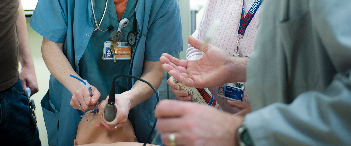 A nursing anesthesia student practices intubation on a dummy
