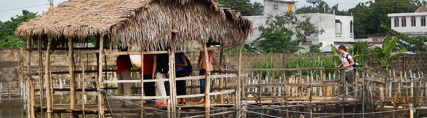 Students tour a raised structure in Zambezi