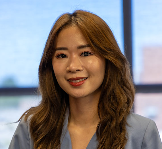 Daisy Lee, woman with brown hair and blue blouse  