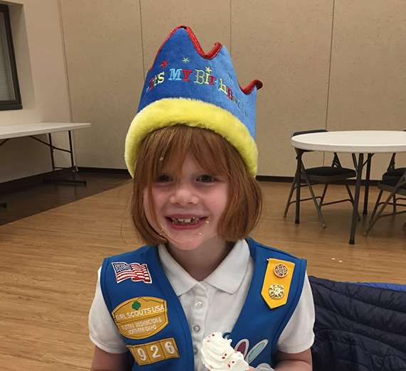 young girl in girl scout costume