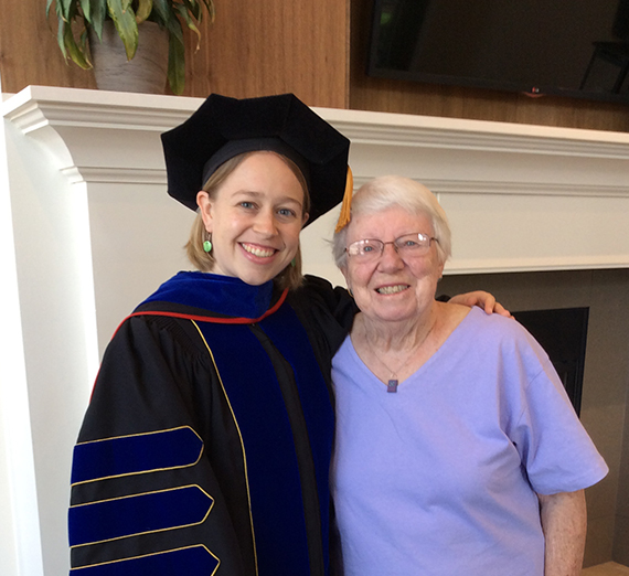 Professor Shultis in cap and gown with grandma