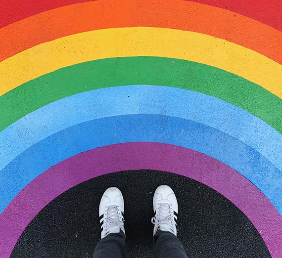 Colored rainbow around a person's feet.