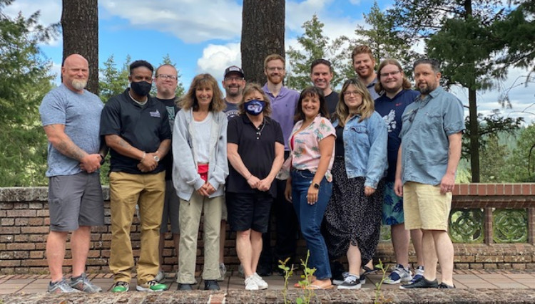 Members of GUEST pose together for a team photo