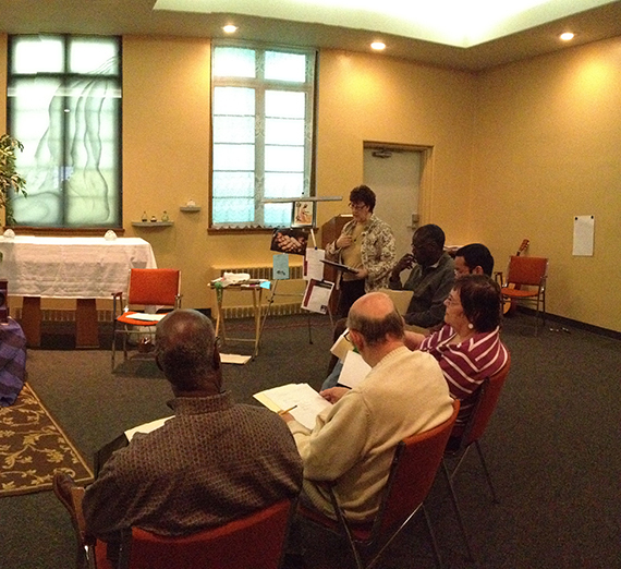 A group worships together at the ministry institute.