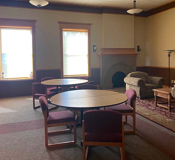 The Hearth Room space with tables and chairs.