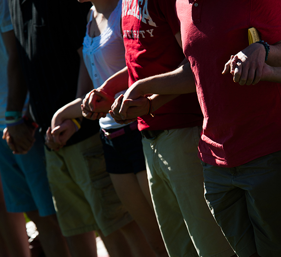 Students holding hands