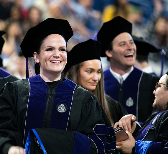 School of Law graduates smiling.