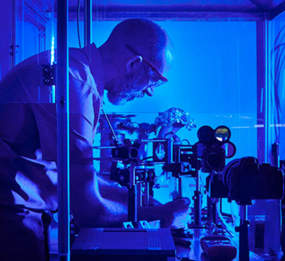 Dr Marc Baumgardner in blue light lab